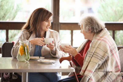 caregiver talking with senior woman