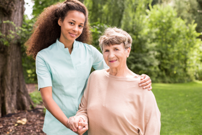 caregiver and senior smiling